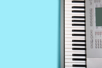 Modern synthesizer keyboard on blue background