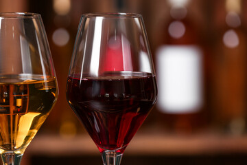 Glasses of exquisite wine in cellar, closeup