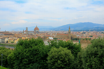 Fototapeta na wymiar Florence cityscape and skyline panorama during summer time. Panoramic view of Florence from Michelangelo Square, Tuscany. The wonderful artistic and historical Florence city in Italy. Travel scene.