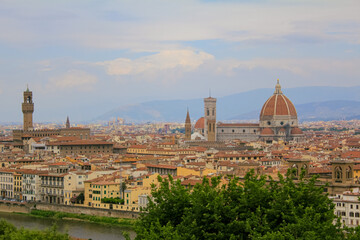 Fototapeta na wymiar Florence cityscape and skyline panorama during summer time. Panoramic view of Florence from Michelangelo Square, Tuscany. The wonderful artistic and historical Florence city in Italy. Travel scene.