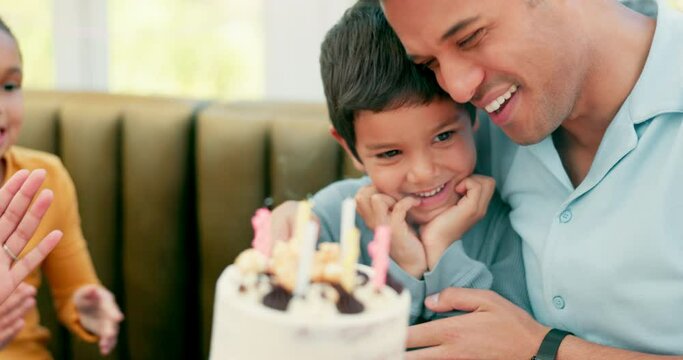 Hug, happy child and blow birthday cake candles at home family party to celebrate fun event of young kid. Congratulations, excited and youth boy smile for candy dessert, sweets or embrace from father