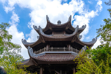 Naklejka premium Bai Dinh Buddhist temple in Ning Binh Vietnam filled with architectural marvels of statues icons and magnificent Buddha buildings with classic ancient design 