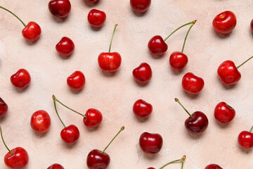 Many sweet cherries on pink background