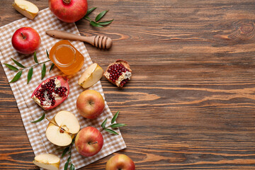 Composition with ripe fruits and honey on wooden background. Rosh hashanah (Jewish New Year) celebration
