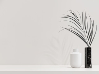 Mockup Palm leaf in black marble vase with white wall background