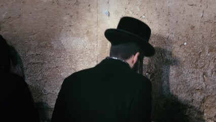 Orthodox Jew Engaged in Prayerful Mourning at the Wailing Wall