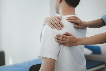 A professional physiotherapist is doing stretching for a patient, the patient has muscle...