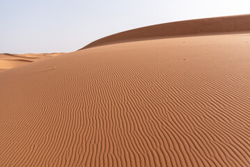 Fototapeta na wymiar Picturesque dunes in the Erg Chebbi desert, part of the African Sahara