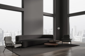 Minimalistic gray living room corner with couch, armchairs and windows