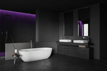 Fototapeta na wymiar Black bathroom interior with sink, bathtub and shower behind partition
