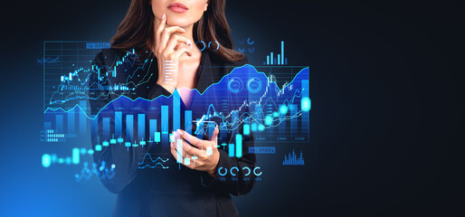Businesswoman with smartphone, forex diagrams with financial sta