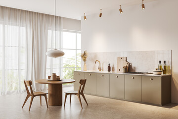 White kitchen corner with beige cabinets and table