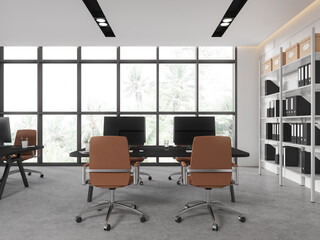 Modern office room interior with pc computer on table, shelf with window