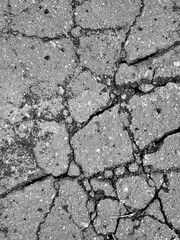 Obraz premium Texture cracked Asphalt. Broken Wall. Grunge background with space for text. Vertical stone backdrop with copy space.