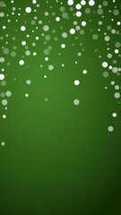 Snowy christmas background. Subtle flying snow flakes and stars on christmas green background. Delicate sweet snowy christmas. Vertical vector illustration.
