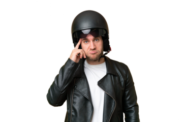 Young caucasian man with a motorcycle helmet isolated on green chroma background thinking an idea