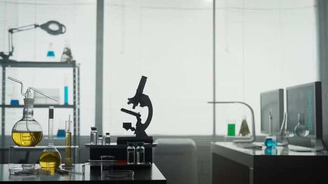 Modern medical research laboratory with a microscope and test tubes with biochemicals on the table. Scientific laboratory.