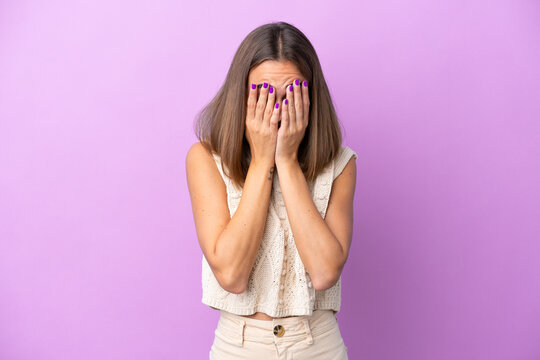 Young caucasian woman isolated on purple background with tired and sick expression