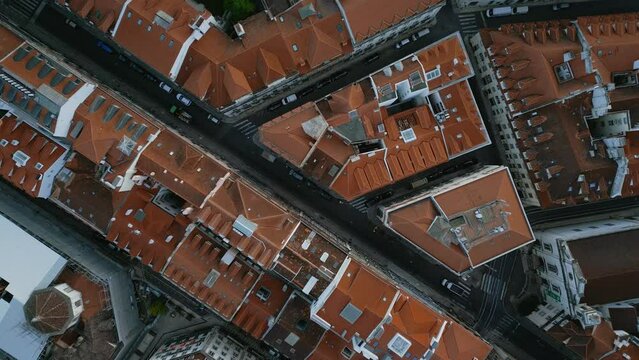 Aerial view of terracotta roof tiles of aged town buildings
