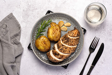 Food photography of roasted chicken, potato, garlic, rosemary, white wine, fork, knife, towel, meal, food