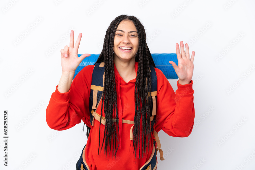 Poster Hiker teenager girl with braids over isolated white background counting eight with fingers