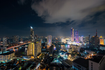 Aerial view of Bangkok skyline and skyscraper in Bangkok downtown. Panorama  over Chao Phraya River Bangkok Thailand at sunset.