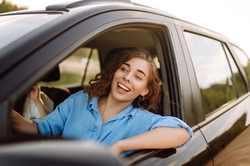 Two Young woman is resting and enjoying the trip in the car Automobile journey, traveling,...