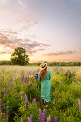 Beautiful  woman in style dress on blooming fragrant lavender fields. Nature, vacation, relax and...