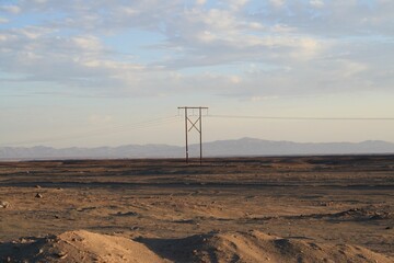 Barren landscape with power lines in the distance. Peru.