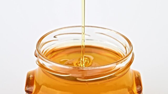 Dripping honey from spoon