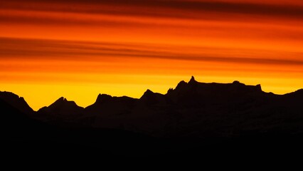 Scenic view of rocky mountains at sunset