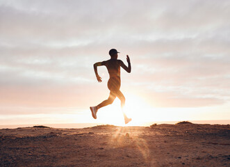 Sunset, running and silhouette with woman in nature for health, workout and fitness challenge. Performance, sports and exercise with runner training in outdoor for speed, marathon and wellness mockup