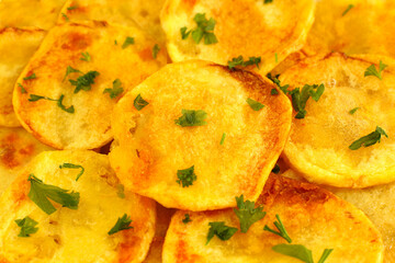 Fried potatoes close up, slices