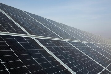 View of a cluster of solar panels on a sunny day