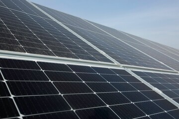 View of a cluster of solar panels on a sunny day