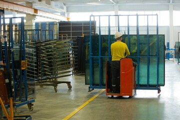 Manufacturing environment producing PVC windows in a factory