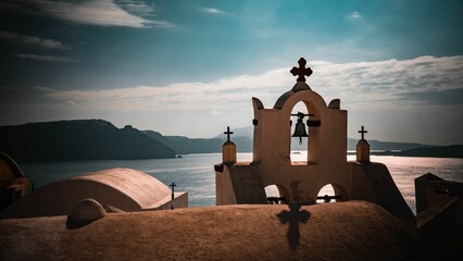 Picturesque bell tower at a Greek Orthodox church in Oia, on the island of Santorini, Greece