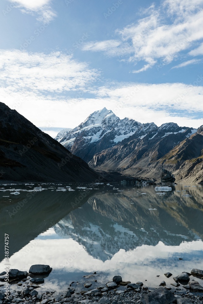 Sticker Scenic view of a valley with Mount Cook in the background.