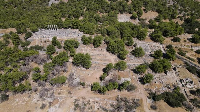 View of historical ruins, columns, ancient theater and temples in the ancient city of Priene.