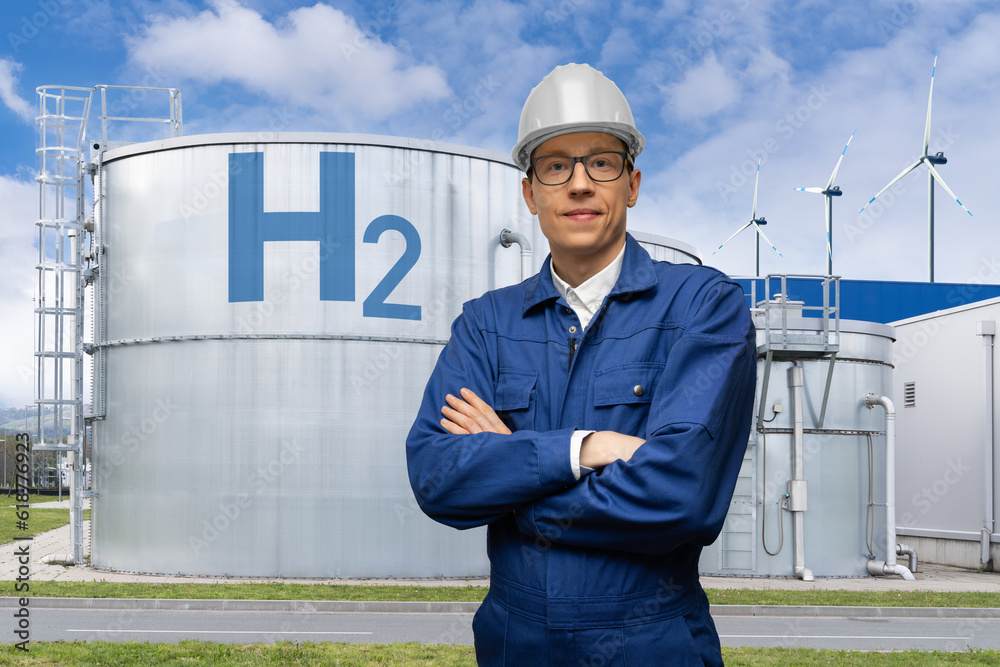 Poster engineer in helmet on a background of hydrogen factory.