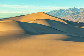 Stunning view of the Mesquite Sand Dunes in Death Valley National Park, California, during sunrise.