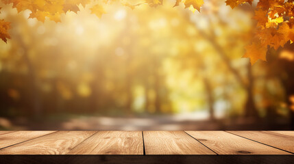 Naklejka na ściany i meble Empty brown wooden table in front of art abstract bokeh background of maple trees in autumn with shiny of sunlight for your display or montage
