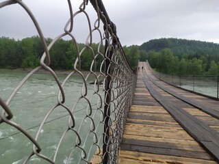 wooden bridge over the river