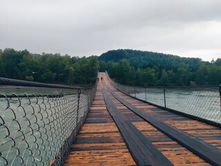 wooden bridge over the river