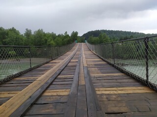 wooden bridge over the river