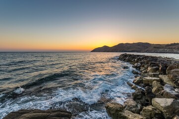 Mesmerizing view of a beautiful seascape during sunrise in Crete, Greece