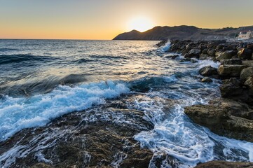 Mesmerizing view of a beautiful seascape during sunrise in Crete, Greece