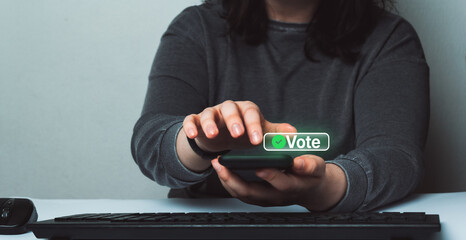 Woman use smartphone to vote online. Political concept. Electronic internet voting. Customer...