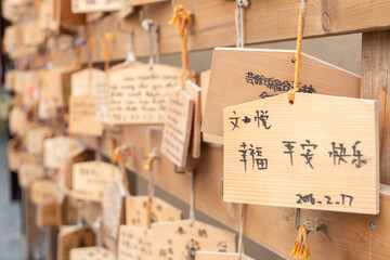 White paper tie knot in Tokyo and Kyoto Japan shrine temple tourism wish and pray for luck, symbol...