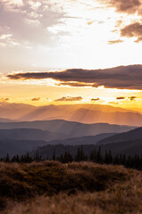 Obraz premium landscape in the mountains, sunset, silhouettes of peaks, Montenegrin mountain range, Carpathians, travel, screensaver, poster, poster, cover, print, spring, winter